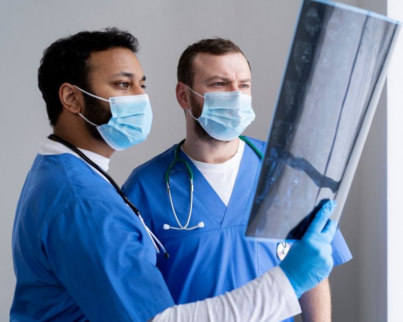 medium-shot-nurses-looking-radiography_23-2149310026